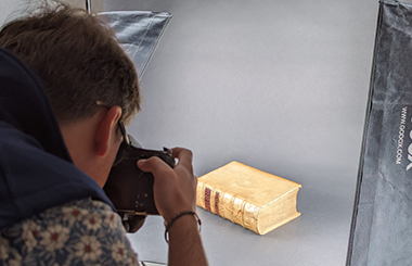 Detailed photographic capture of Maison d’Érasme documents in situ, preserving binding, covers, and unique physical features